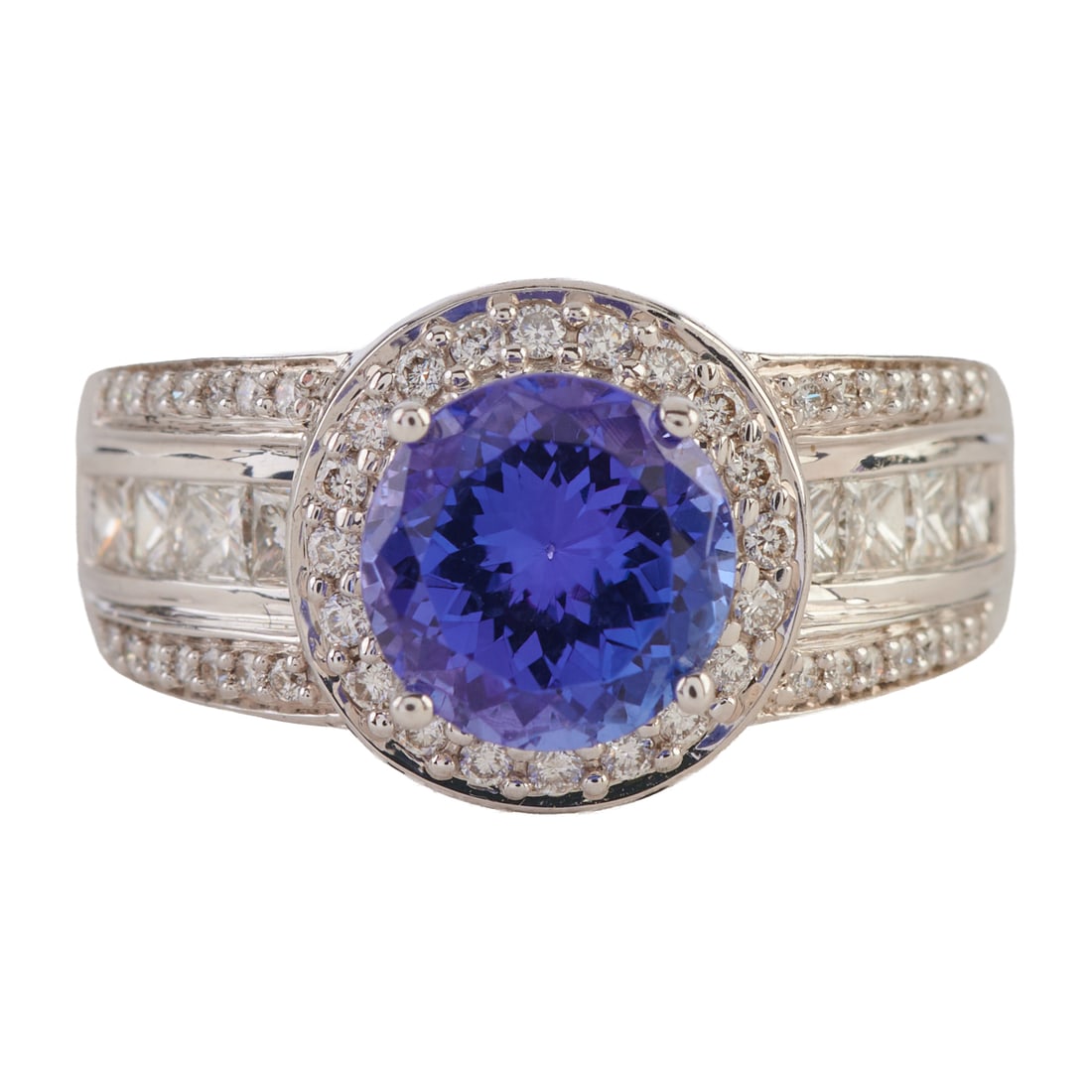 Tanzanite, Diamond, 18k White Gold Ring. Featuring one round-cut tanzanite weighing approximately (1 of 5)