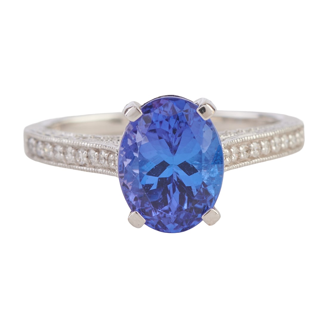 Tanzanite, Diamond, 18k White Gold Ring. Featuring one oval-cut tanzanite weighing approximately (1 of 4)