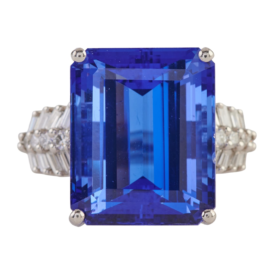 Rhapsody Tanzanite, Diamond, Platinum Ring. Featuring one emerald-cut tanzanite weighing: Rhapsody Tanzanite, Diamond, Platinum Ring. Featuring one emerald-cut tanzanite weighing approximately 19.35 cts., accented by eight full-cut and sixteen tapered baguette-cut diamonds weighing a total