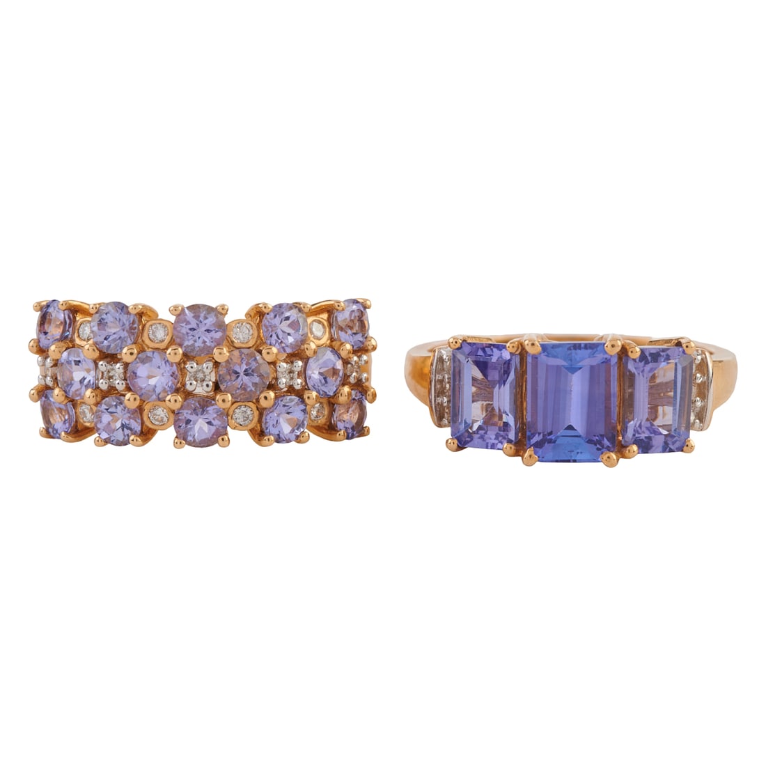 Two Tanzanite, Diamond, 14k Yellow Gold Rings. Including one three stone emerald-cut tanzanite,: Two Tanzanite, Diamond, 14k Yellow Gold Rings. Including one three stone emerald-cut tanzanite, diamond, 14k yellow gold ring, size 7 together with a tanzanite, diamond, 14k yellow gold ring, size 7. 