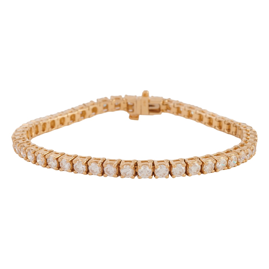 Diamond, 14k Yellow Gold Tennis Bracelet. Featuring forty-eight round brilliant-cut diamonds: Diamond, 14k Yellow Gold Tennis Bracelet. Featuring forty-eight round brilliant-cut diamonds weighing a total of approximately 5.30 cttw., set in a 14k yellow gold mounting, completed by a tongue and 