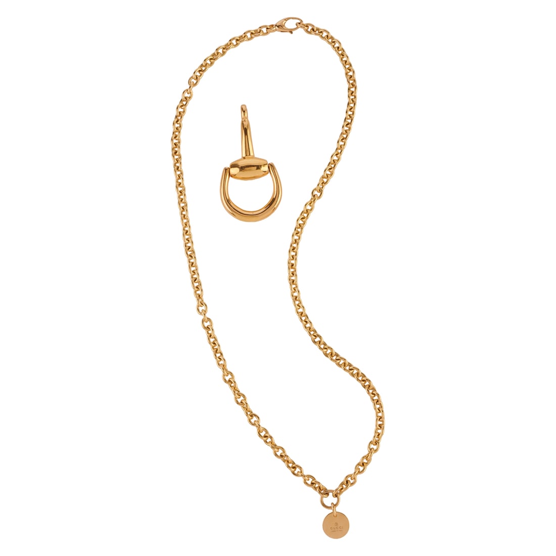 Gucci 18k Yellow Gold Chain and Pendant. Including one Gucci 18k yellow gold horsebit pendant: Gucci 18k Yellow Gold Chain and Pendant. Including one Gucci 18k yellow gold horsebit pendant measuring approximately 54 x 28 mm together with a Gucci 18k yellow gold open oval link measuring approxim
