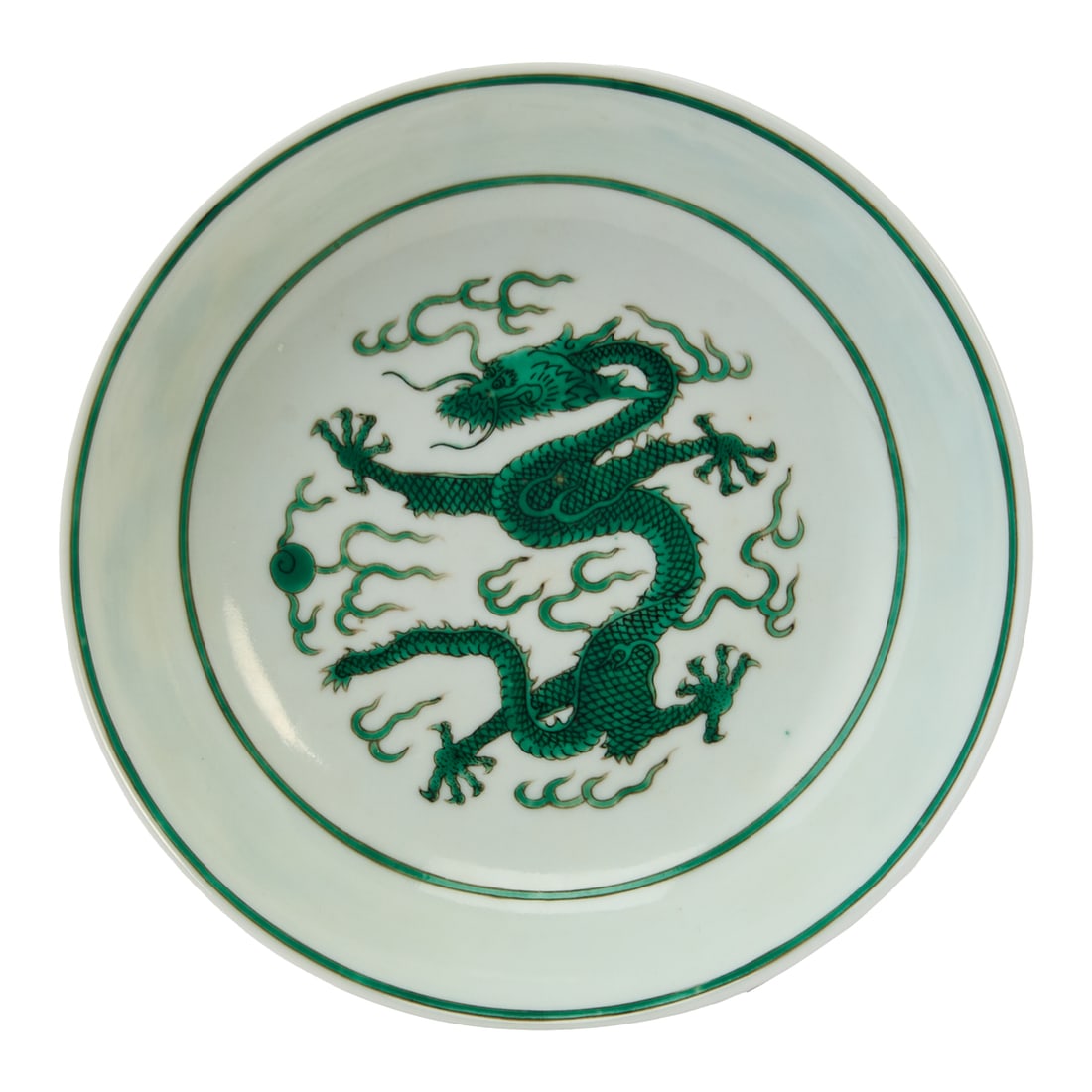 A Daoguang Green-Glazed Dragon Dish Qing Dynasty, Daoguang Period (1821-1850) Finely potted and: A Daoguang Green-Glazed Dragon DishQing Dynasty, Daoguang Period (1821-1850)Finely potted and elegantly proportioned, this shallow porcelain dish