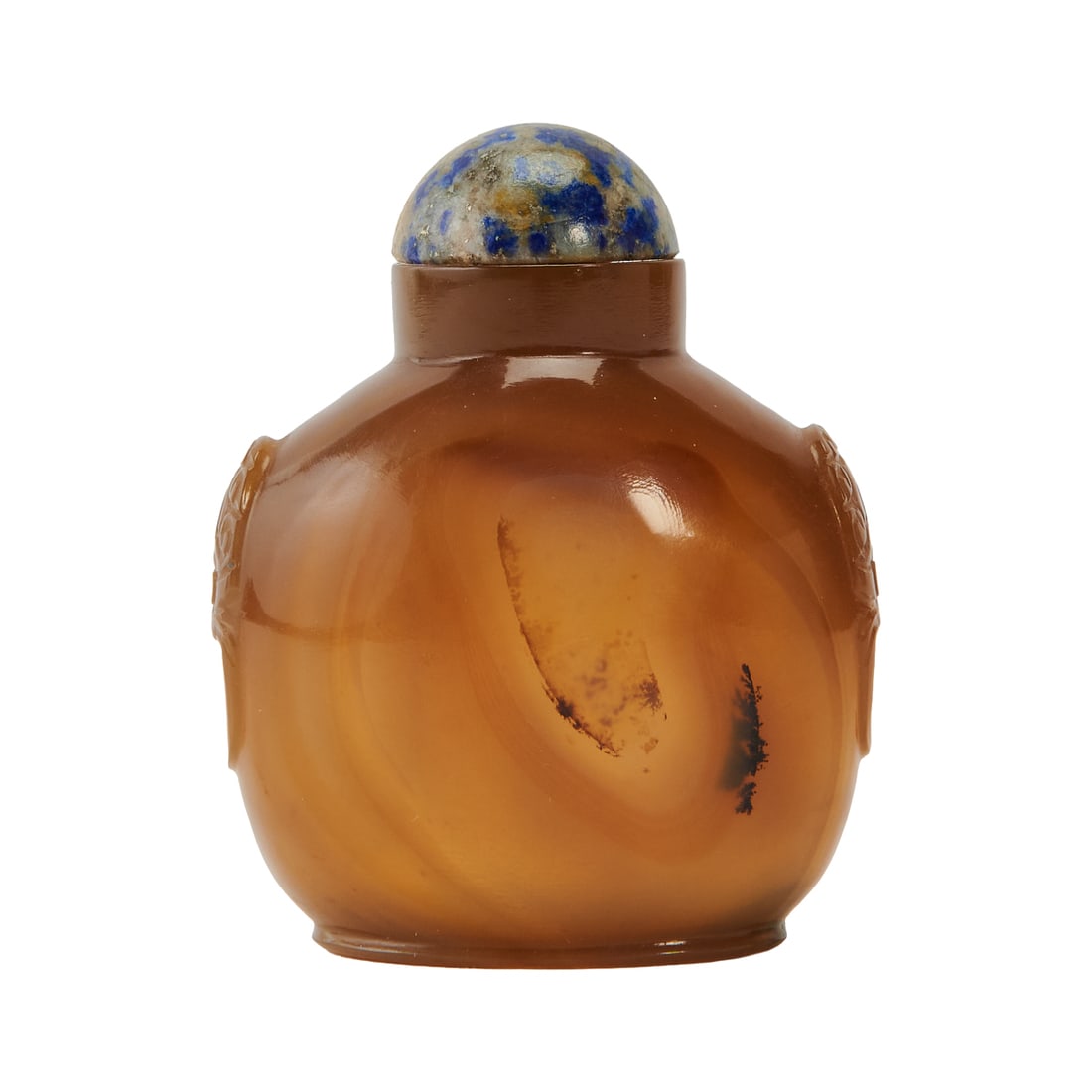 Floating Agate Snuff Bottle Late Qing Dynasty Carved from a translucent honey-brown agate of: Floating Agate Snuff BottleLate Qing DynastyCarved from a translucent honey-brown agate of exceptional lightness, the bottle is fashioned in a flatt