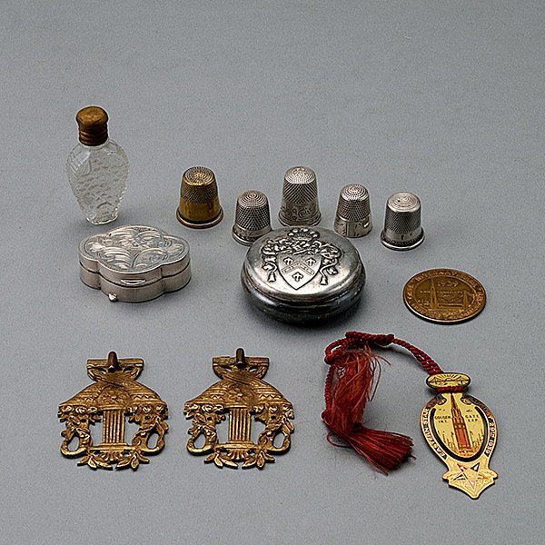 1939 Golden Gate Medallion and Bookmark, etc.: Group of Personal Items: Comprising 1939 Golden Gate Medallion and Bookmark; Sterling Cartouche Box; Pair of Tie Backs; Hotel Washington Plated Box, Scent Bottle; and Four Thimbles, Four Sterling (12)