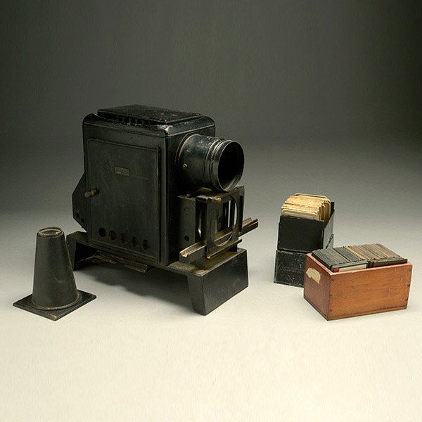 Magic Lantern Projector,: Magic Lantern Projector, with approximately five hundred slide plates {Dimensions 15 1/2 x 16 x 7 1/4 inches}