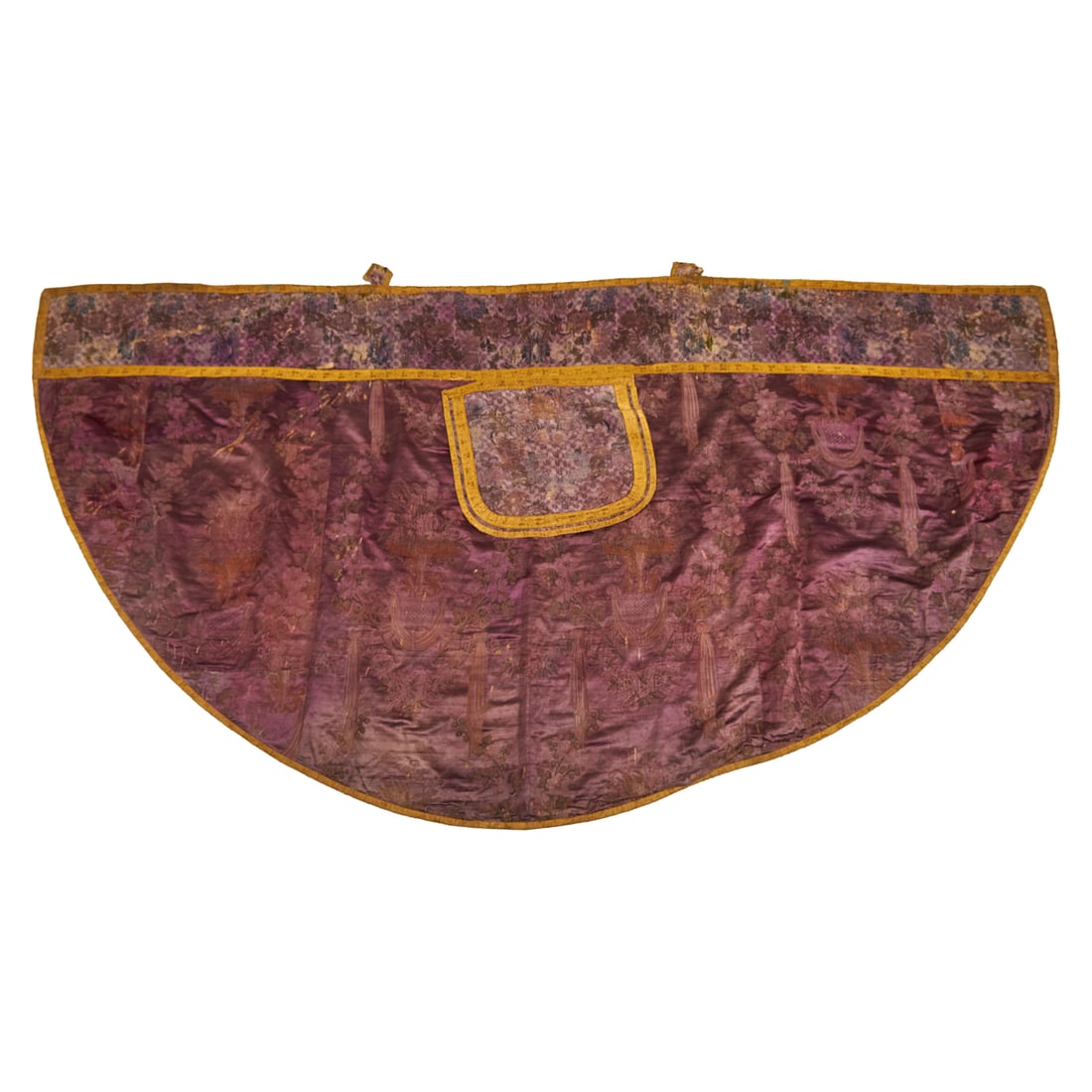 Antique French Silk Damask Cope, the purple brocatelle with extensive embroidered sections, with: Antique French Silk Damask Cope, the purple brocatelle with extensive embroidered sections, with extensive foliate and floral motifs, putti embracing blooming trees emergent from jardinieres, above sw