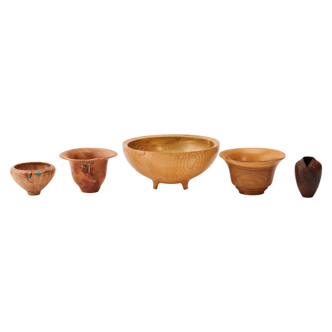 Five Brenda Behrens Turned and Carved Vessels, one with turquoise inlay, the largest of pecan wood: Five Brenda Behrens Turned and Carved Vessels, one with turquoise inlay, the largest of pecan wood with gold wash to bowl interior, and one with carved beads in the form of miniature urns on leather t