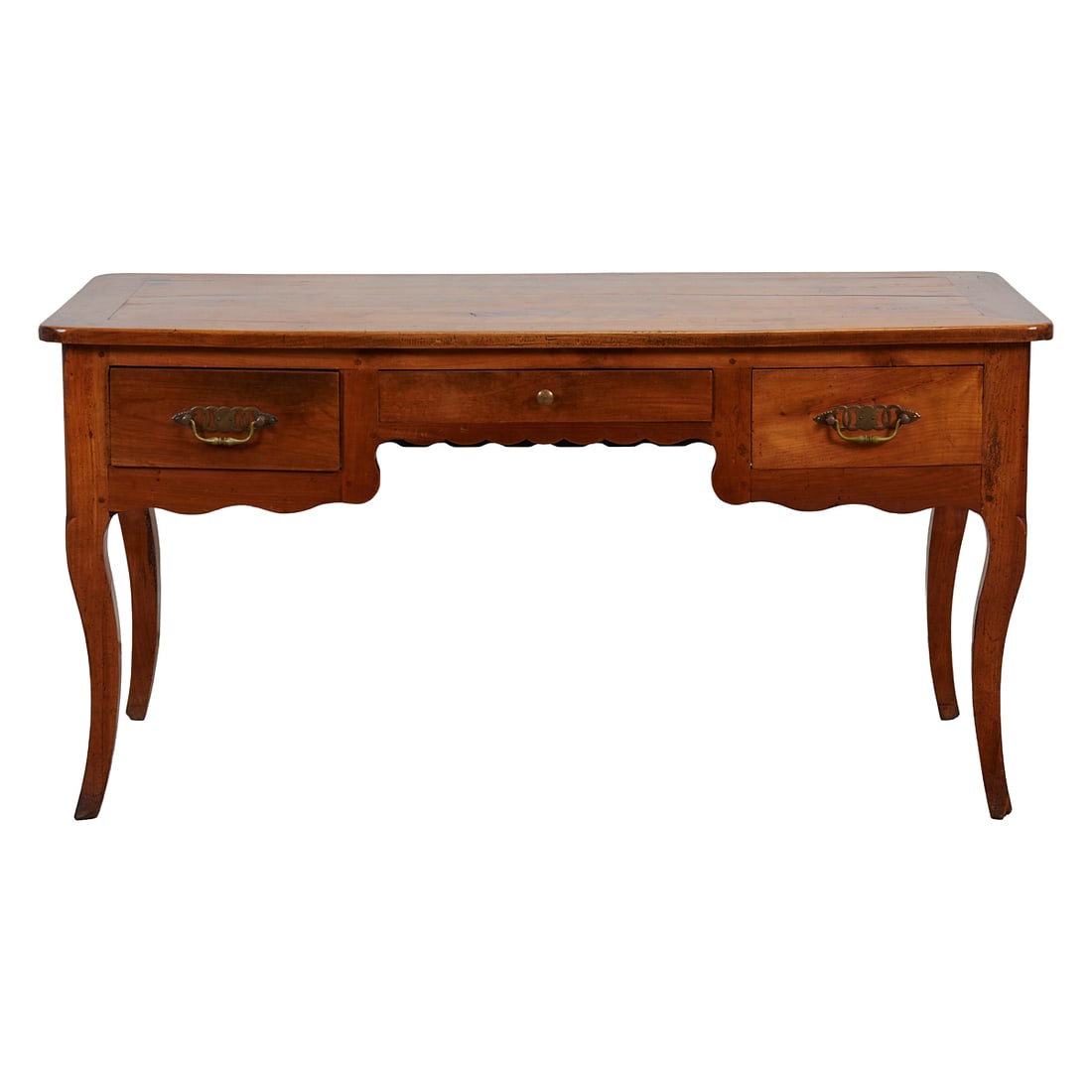 French Louis XV Provincial Style Fruitwood Bureau Plat, the rounded rectangular top overcast above: French Louis XV Provincial Style Fruitwood Bureau Plat, the rounded rectangular top overcast above recessed center, shallow drawer flanked by deep side drawers, with gilt brass pulls and escutcheons w