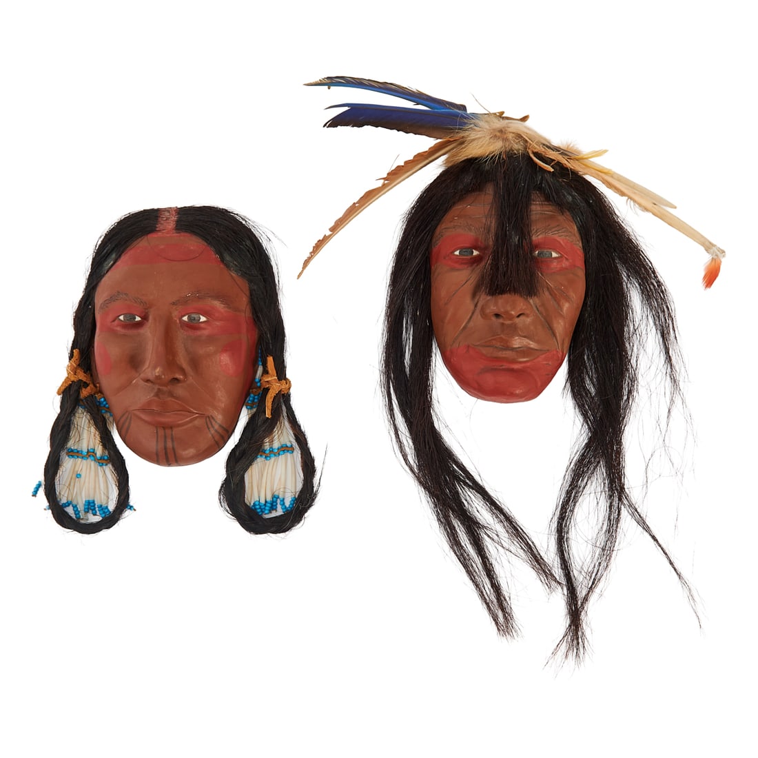 Two Becky Olvera Schultz Mixed Media Masks, clay, paint, horsehair, feathers, beads, etc. Titled: Two Becky Olvera Schultz Mixed Media Masks, clay, paint, horsehair, feathers, beads, etc. Titled "Cree Man" and"Cree Woman," signed, and inscribed, "Open Edition," the male dated 1994, and the female 
