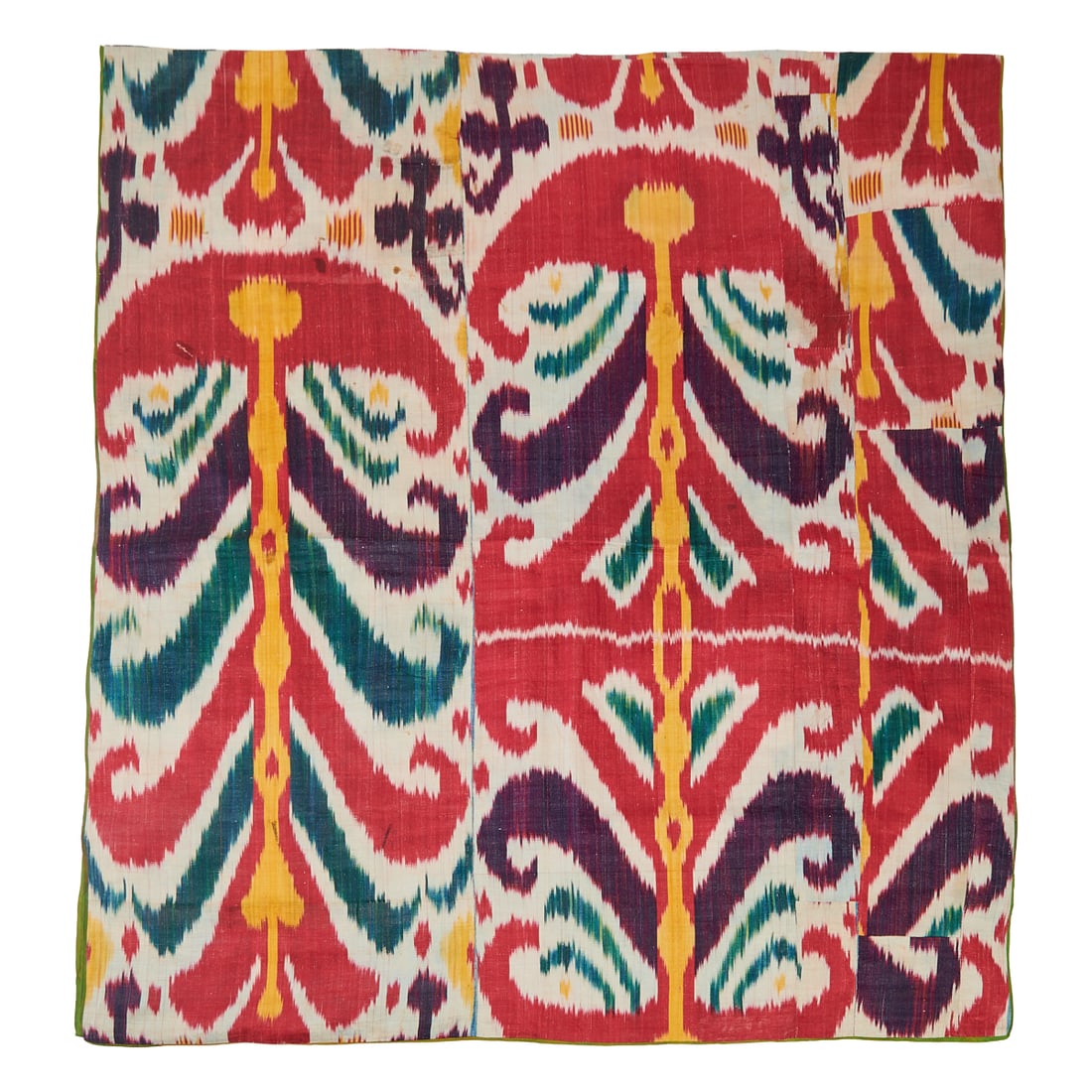 Uzbek Silk Ikat Panel, stitched from multiple panels. The whole lined in pink and white printed: Uzbek Silk Ikat Panel, stitched from multiple panels. The whole lined in pink and white printed cotton. Late 19th Century, with later lining.{Approximate dimensions: 68 x 35 1/4 inches.}.