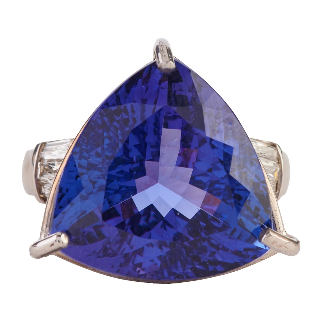 Tanzanite, Diamond, Platinum Ring. Featuring one triangular-cut tanzanite weighing approximately: Tanzanite, Diamond, Platinum Ring. Featuring one triangular-cut tanzanite weighing approximately 14.20 cts., accented by six tapered radiant-cut diamonds weighing a total of approximately 0.50 cttw., 