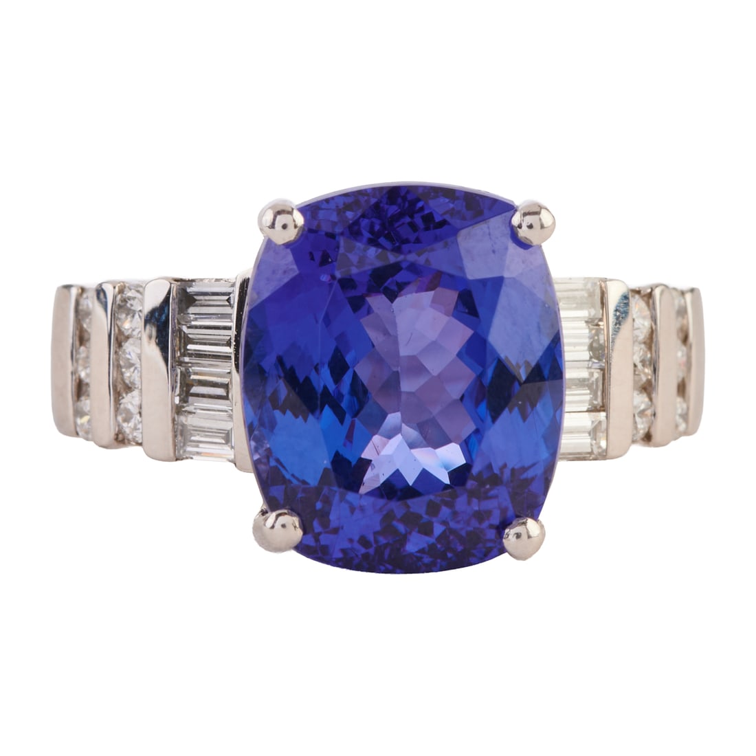 Rhapsody Tanzanite, Diamond, Platinum Ring. Featuring one cushion-cut tanzanite weighing: Rhapsody Tanzanite, Diamond, Platinum Ring. Featuring one cushion-cut tanzanite weighing approximately 7.20 cts., accented by eight baguette-cut and twelve full-cut diamonds weighing a total of approx