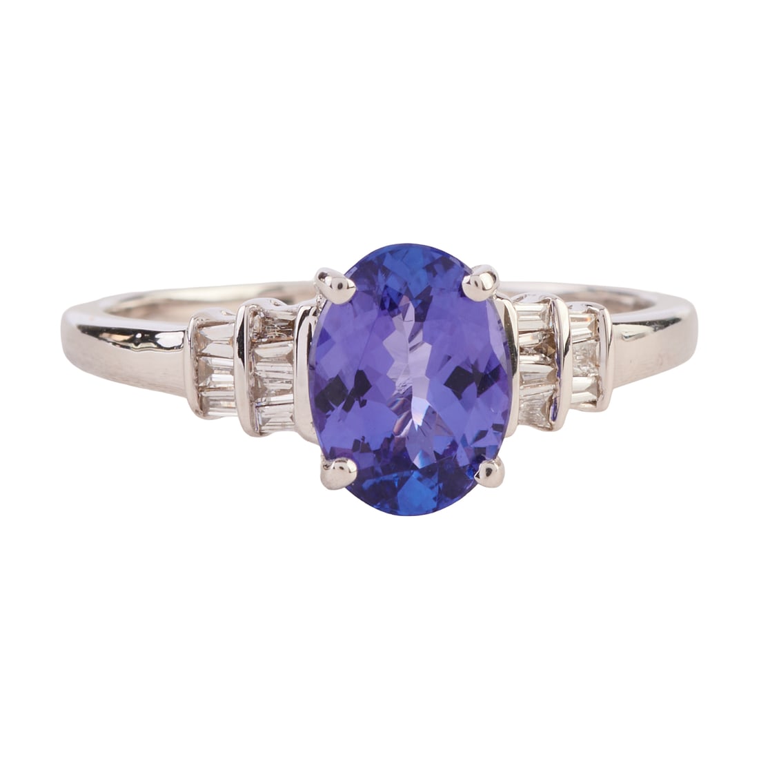 Iliana Tanzanite, Diamond, 18k White Gold Ring. Featuring one oval-cut tanzanite weighing: Iliana Tanzanite, Diamond, 18k White Gold Ring. Featuring one oval-cut tanzanite weighing approximately 1.05 ct., accented by fourteen tapered baguette-cut diamonds weighing a total of approximately 0