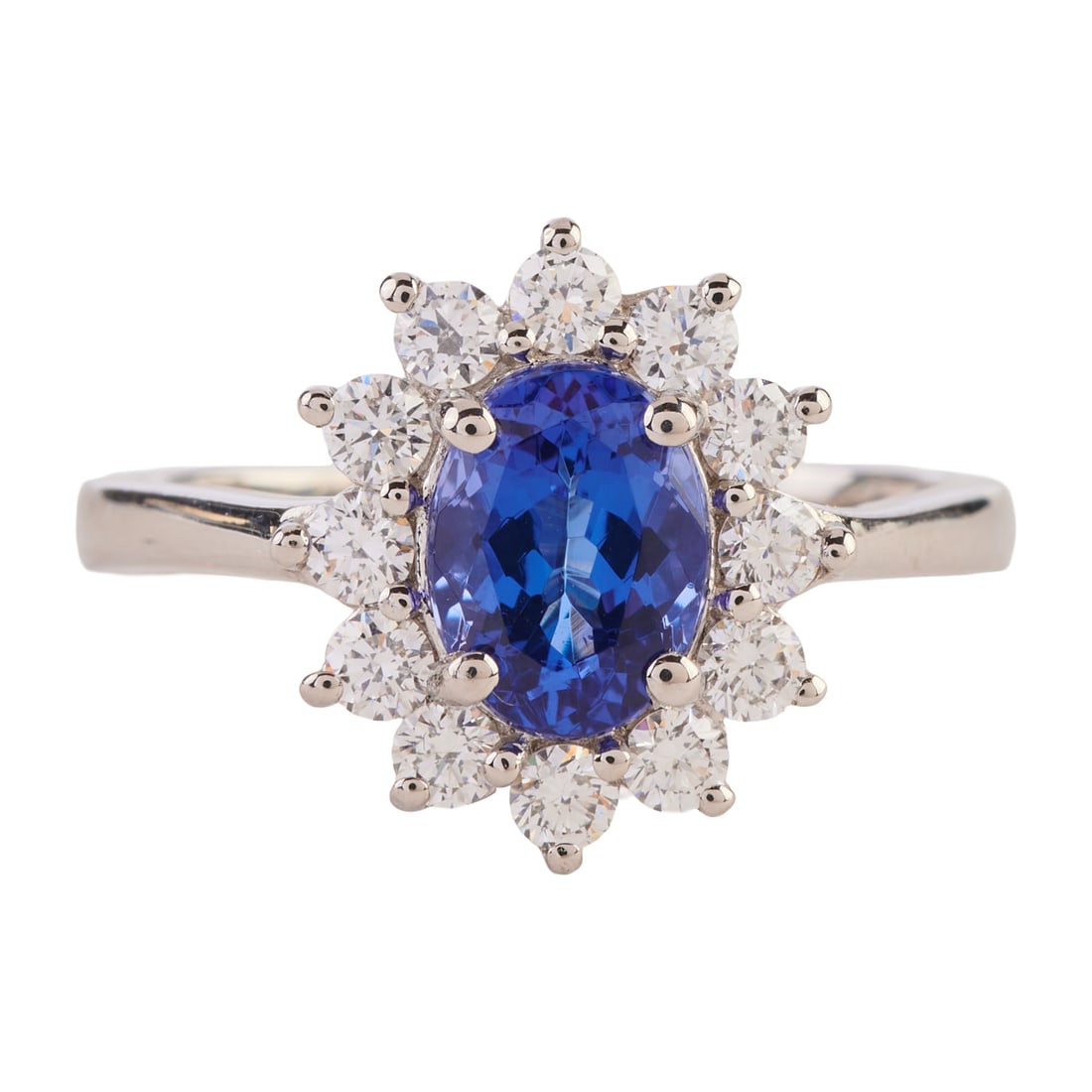 Rhapsody Tanzanite, Diamond, Platinum Ring. Featuring one oval-cut tanzanite weighing approximately: Rhapsody Tanzanite, Diamond, Platinum Ring. Featuring one oval-cut tanzanite weighing approximately 1.30 ct., surrounded by twelve full-cut diamonds weighing a total of approximately 0.55 cttw., set i