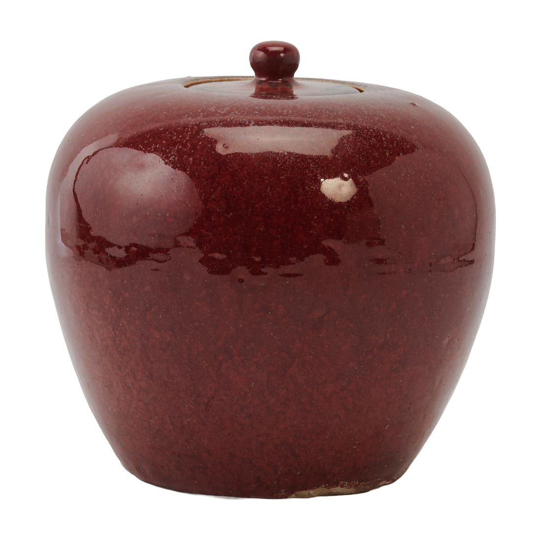 A Chinese Red-Glazed Covered Jar, Late Qing DynastyA Chinese porcelain covered jar, dating to the: A Chinese Red-Glazed Covered Jar, Late Qing DynastyA Chinese porcelain covered jar, dating to the Late Qing dynasty. Of compressed ovoid form with gently rounded shoulders, a short neck, and a domed c