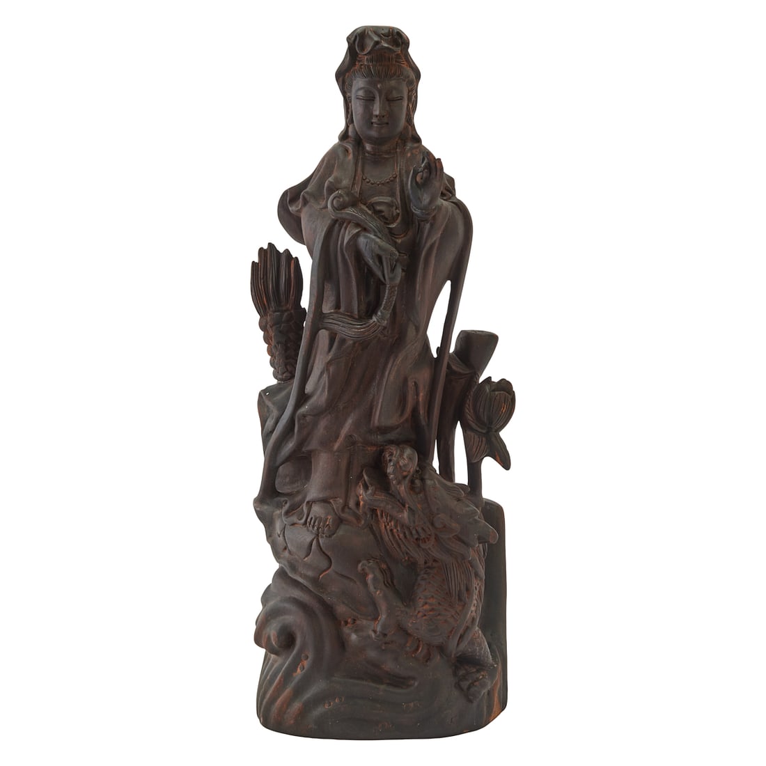A Carved Wood Figure of Guanyin Standing atop a DragonA carved wood figure depicting Guanyin, the (1 of 5)