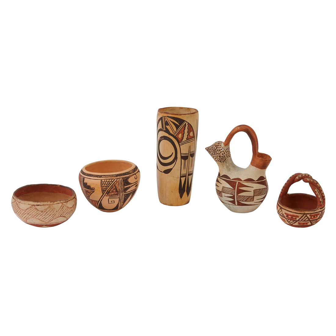 Five Native American Painted Pottery Vessels: Five Native American Painted Pottery Vessels, including a Hopi tall painted cylindrical vessel, a Hopi painted bowl by Lucille Namoki, an Isleta bowl with fixed braided handle, two Acoma pots