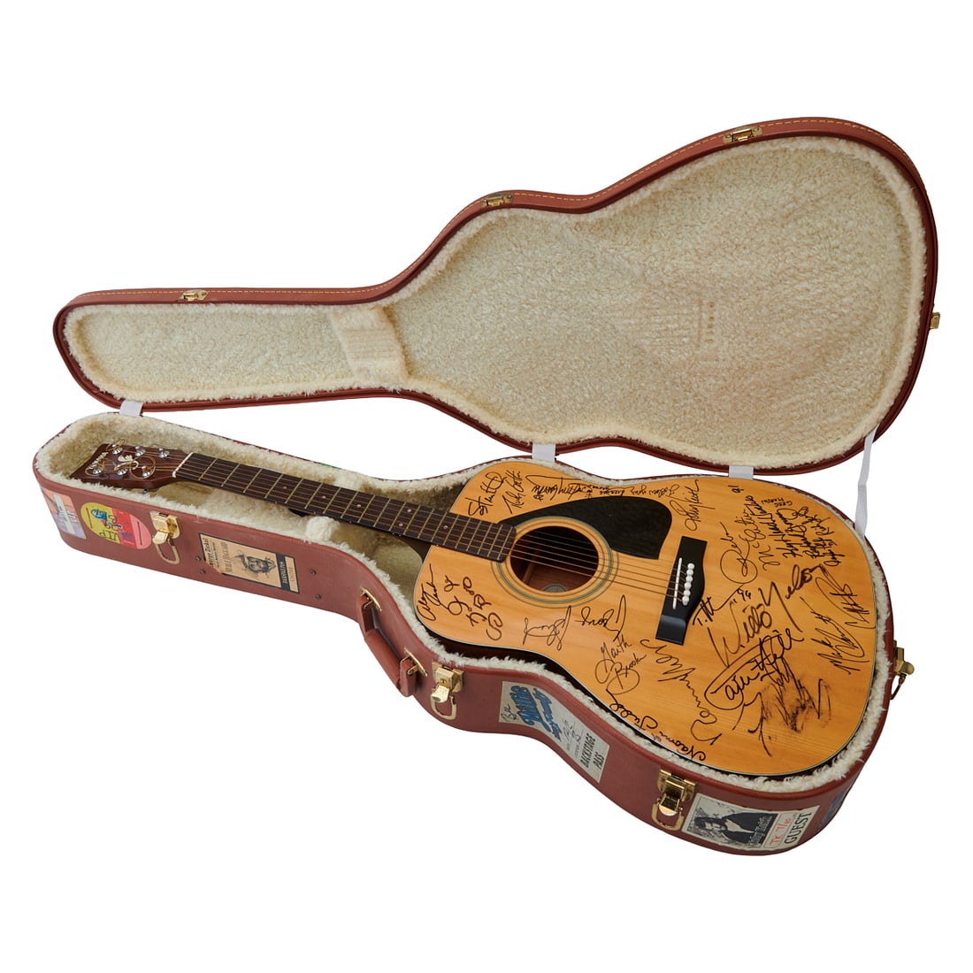 Yamaha Steel String Guitar with Country and Western Star Signatures: Yamaha Steel String Guitar with Country and Western Star Signatures. Yamaha model FG-410E, serial number 7091227, with pick up knobs to top and interior. Body signed by Willie Nelson, Mark Chesnutt,To