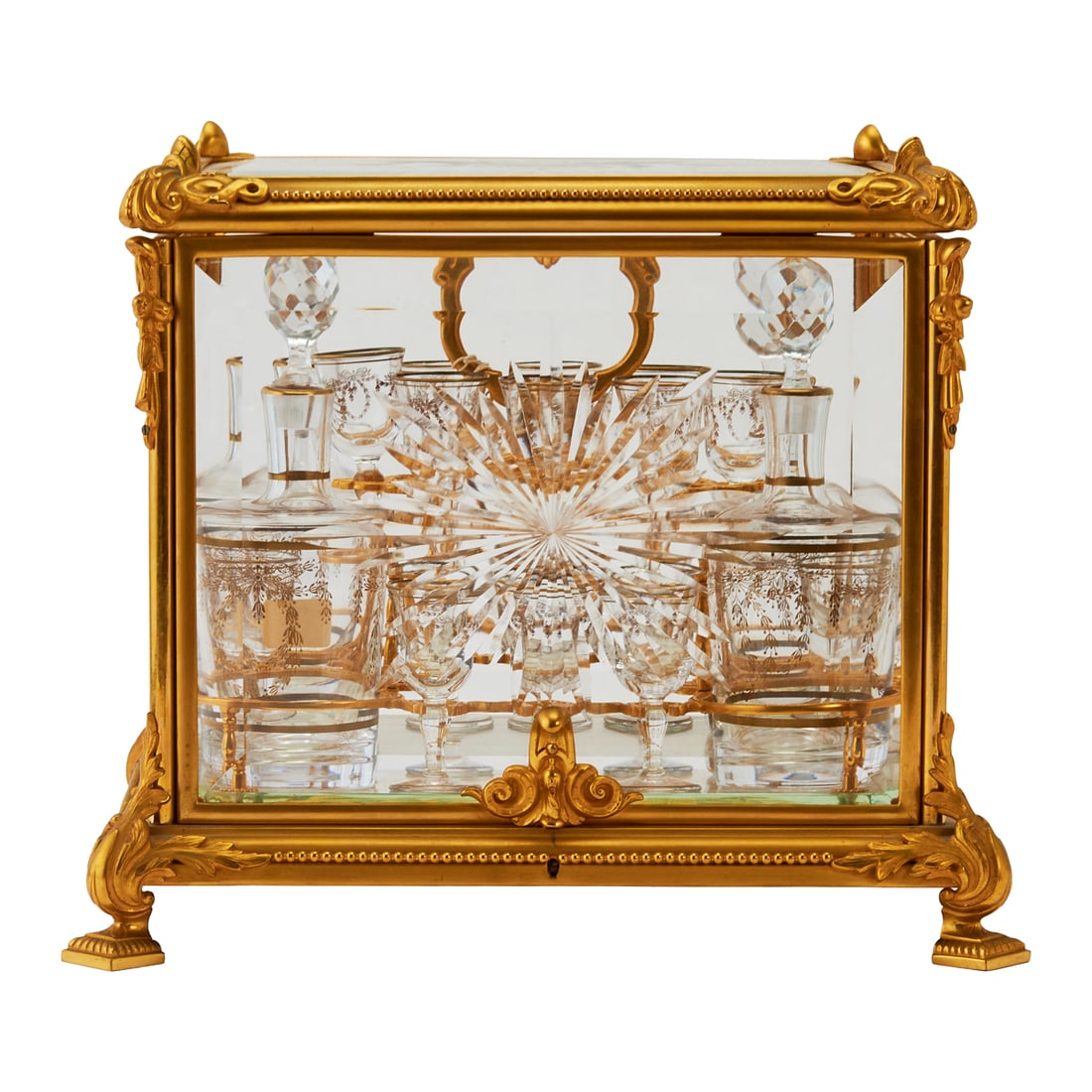 Belle Epoque Style Gilt Bronze and Crystal Tantalus: Belle Epoque Style Gilt Bronze and Crystal Tantalus, the gilt bronze frame with foliate designs to top, and with scrolling foliate designs over flat square feet to base, the beveled glass panels to fr
