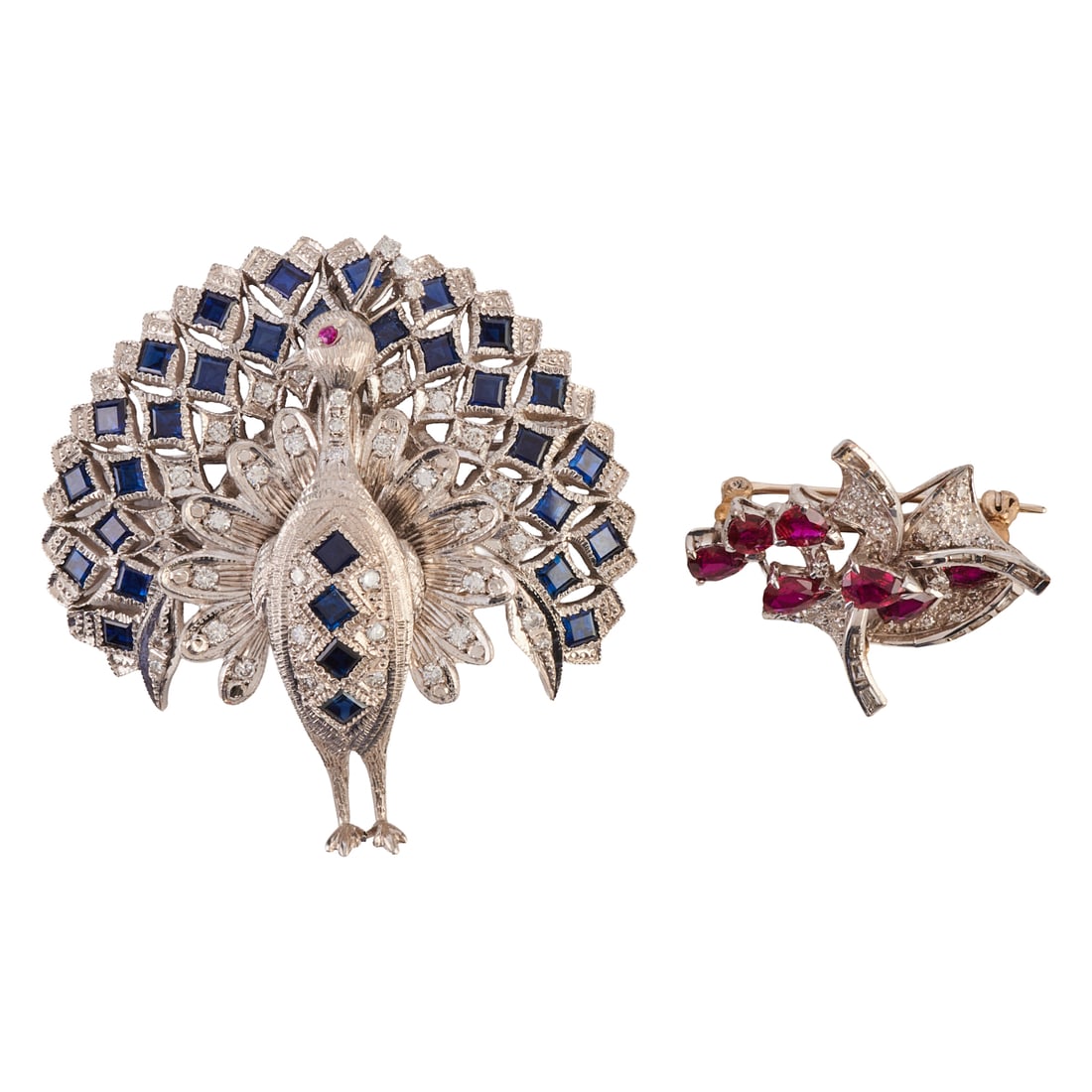 Two Ruby, Sapphire, Diamond, Rhodium-Plated Brooches: Two Ruby, Sapphire, Diamond, Rhodium-Plated Brooches. Including one sapphire, ruby, diamond, rhodium-plate peacock brooch measuring approximately 52 x 50 mm together with a pear-cut ruby, diamond,