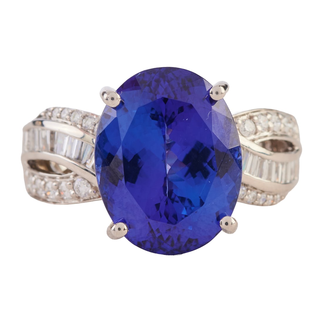 Rhapsody Tanzanite, Diamond, Platinum Ring: Rhapsody Tanzanite, Diamond, Platinum Ring. Featuring one oval-cut tanzanite weighing approximately 7.20 cts., accented by twenty tapered baguette-cut and twenty-two full-cut diamonds weighing a total