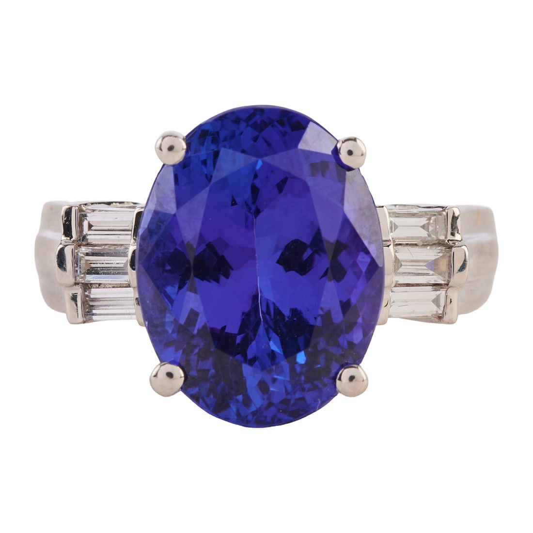 Rhapsody Tanzanite, Diamond, Platinum Ring: Rhapsody Tanzanite, Diamond, Platinum Ring. Featuring one oval-cut tanzanite weighing approximately 8.35 cts., flanked by six baguette-cut diamonds weighing a total of approximately 0.25 cttw., set