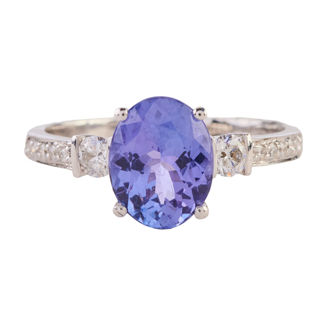 Tanzanite, Diamond, 14k White Gold Ring: Tanzanite, Diamond, 14k White Gold Ring. Featuring one oval-cut tanzanite weighing approximately 1.95 ct., accented by twelve full-cut diamonds weighing a total of approximately 0.25 cttw., set in a 1
