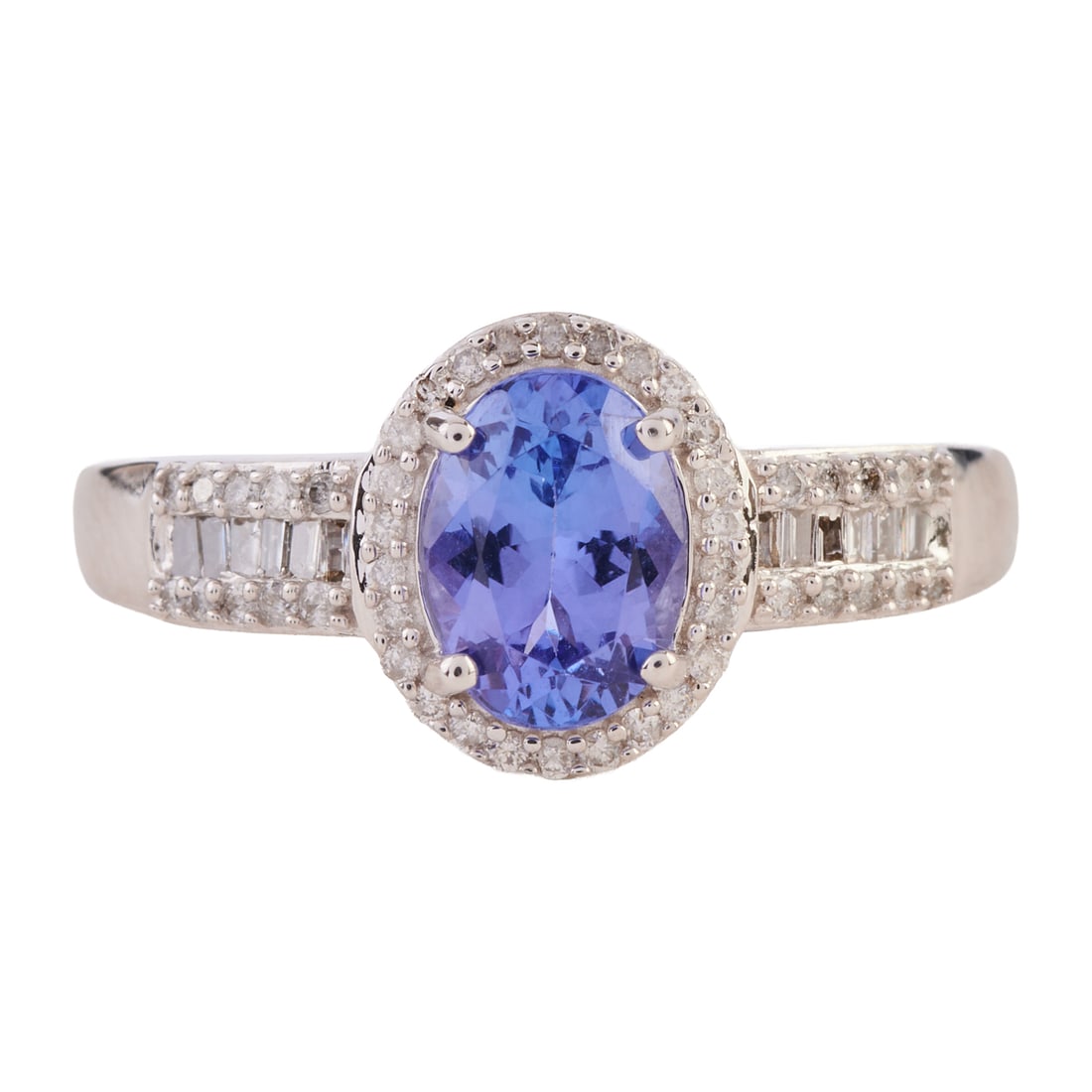 Tanzanite, Diamond, 14k White Gold Ring: Tanzanite, Diamond, 14k White Gold Ring. Featuring one oval-cut tanzanite weighing approximately 1.15 ct., accented by twelve tapered baguette-cut and forty-six full-cut diamonds weighing a total of a