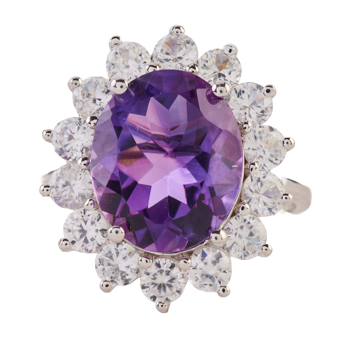 Amethyst, Colorless Topaz, 10k White Gold Ring: Amethyst, Colorless Topaz, 10k White Gold Ring. Centering one oval-cut amethyst measuring approximately 11.8 x 9.6 mm, surrounded by round-cut colorless topaz, set in a 10k white gold mounting. {Size: