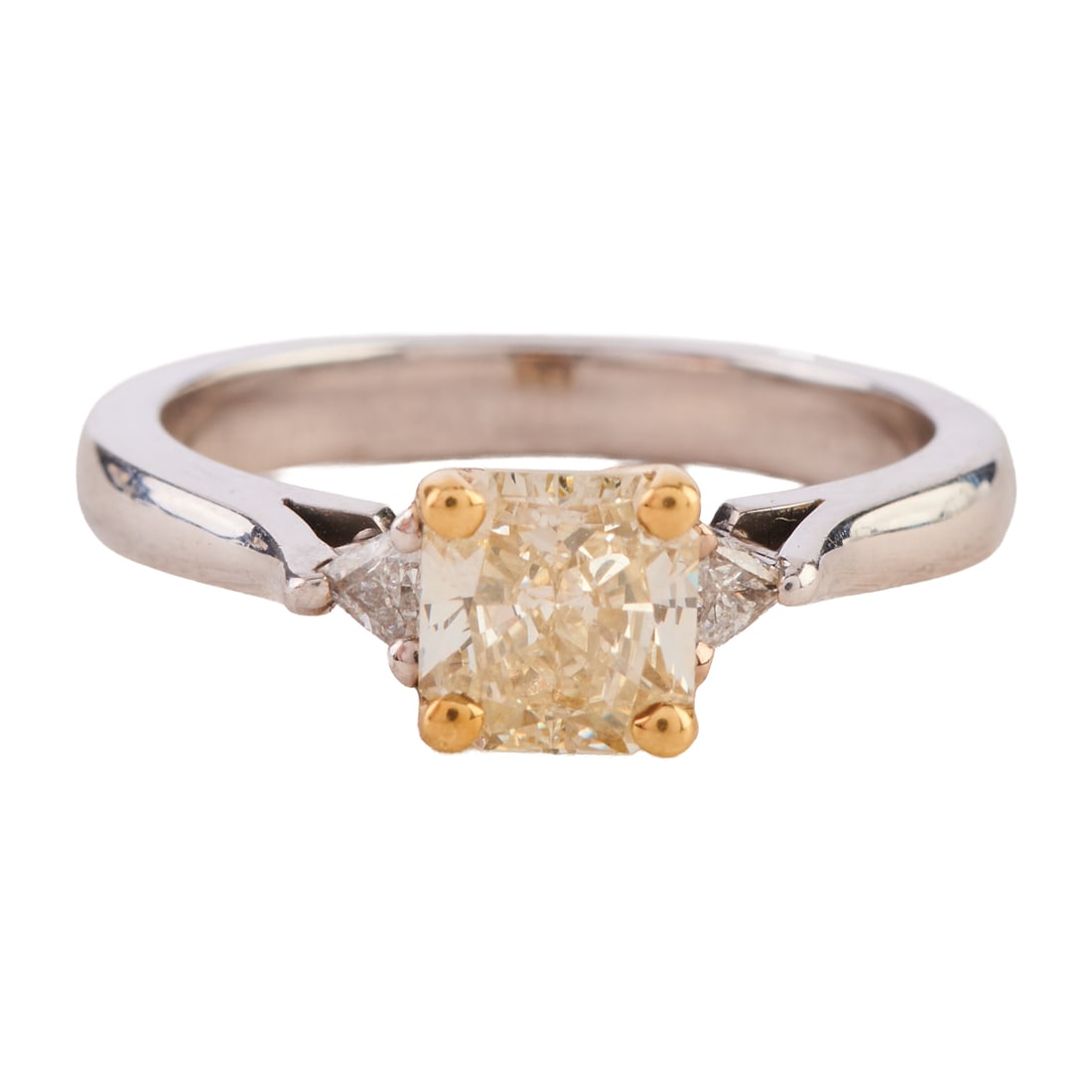 Yellow Diamond, Diamond, 18k White Gold Ring: Yellow Diamond, Diamond, 18k White Gold Ring. Featuring one radiant-cut yellow diamond, flanked by two triangular-cut diamonds, set in an 18k white gold mounting with yellow gold prongs. Total diamond