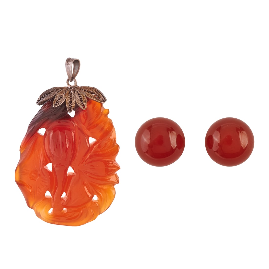 Carnelian, 18k Yellow Gold, Silver Jewelry Suite: Carnelian, 18k Yellow Gold, Silver Jewelry Suite. Including a carved carnelian, silver filigree pendant measuring approximately 47 x 30 mm together with a pair of round carnelian, 18k yellow gold stud