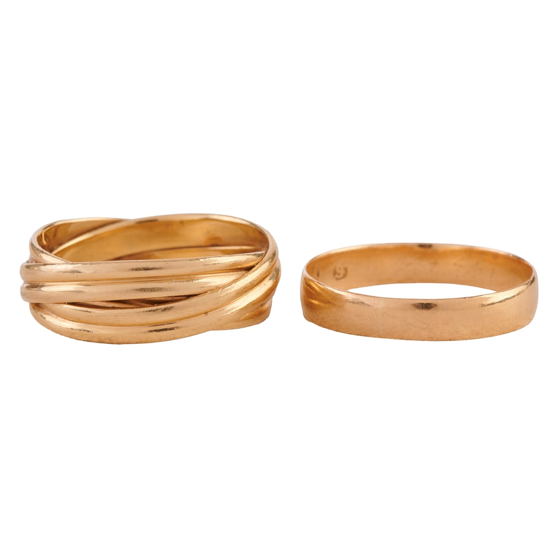 Two 14k Yellow Gold Bands: Two 14k Yellow Gold Bands. Including one 14k yellow gold twisted band measuring approximately 7 mm in width, size 10 1/2 together with one 14k yellow gold band measuring approximately 4 mm in width, s