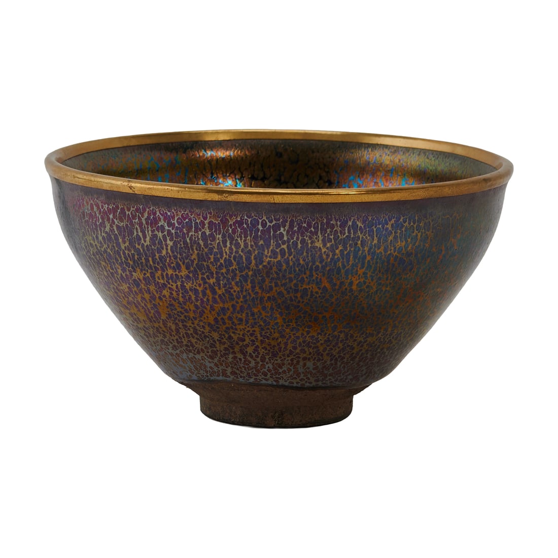 A Chinese Black Glaze Jian Style Tea Bowl: A Chinese Black Glaze Jian Style Tea Bowl. The steep sides rising to a shallow groove below the gently everted rim bound in a silver band, covered overall with a black glaze suffused with fine bluish 