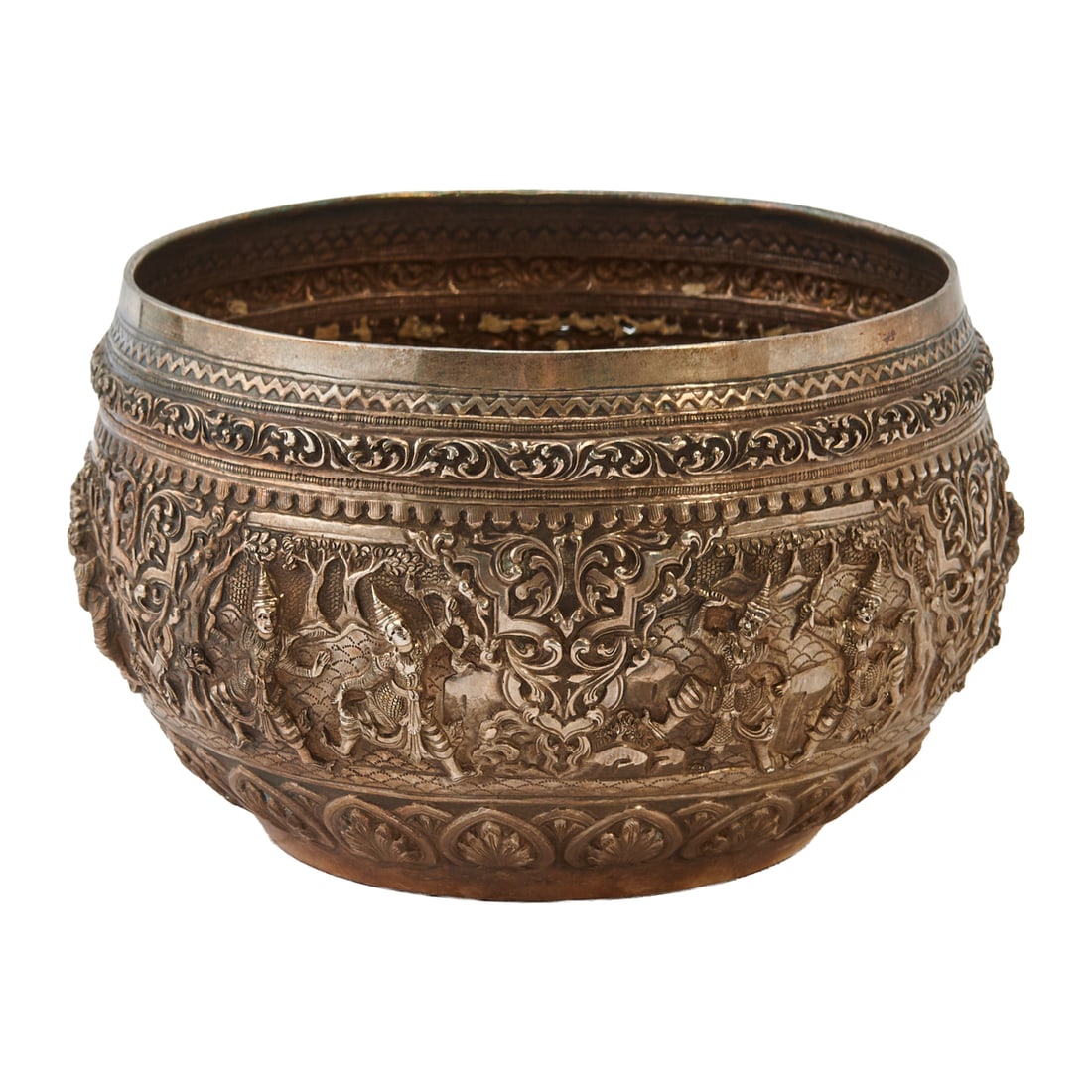 Thai Silver Bowl with Dancers: Thai Silver Bowl with Dancers, the low, globular bowl cast with a band of dancers in cartouches, under bands of zig-zag, floral, lappet designs, and above a lower border of semi palmette leaves. Unmar