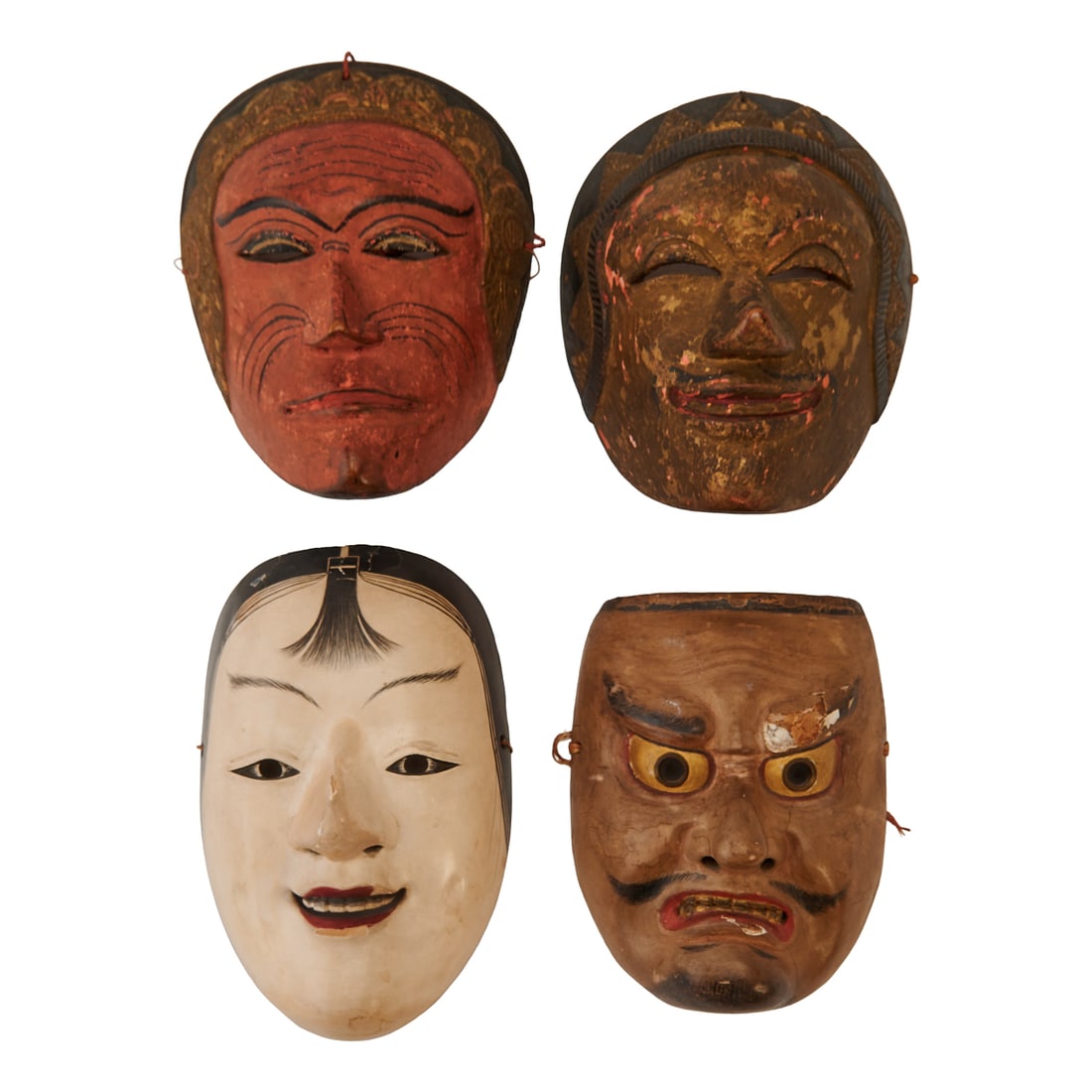 Two Japanese Noh Masks and two Indonesian Topeng Masks: The group comprises four carved and painted wood theatrical masks.The first Japanese Noh mask depicts a fierce supernatural character, possibly of the Kotobide or ?tobide type. The face is modeled wit