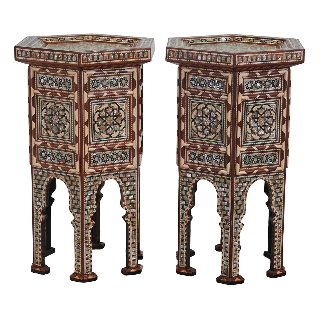 Pair of Moorish Style Inlaid Hexagonal Tables: Pair of Moorish Style Inlaid Hexagonal Tables, with low galleries to tops, overcast above the arch carved side panels, inlaid with bone and mother of pearl applied in geometric patterns.;{Approximate