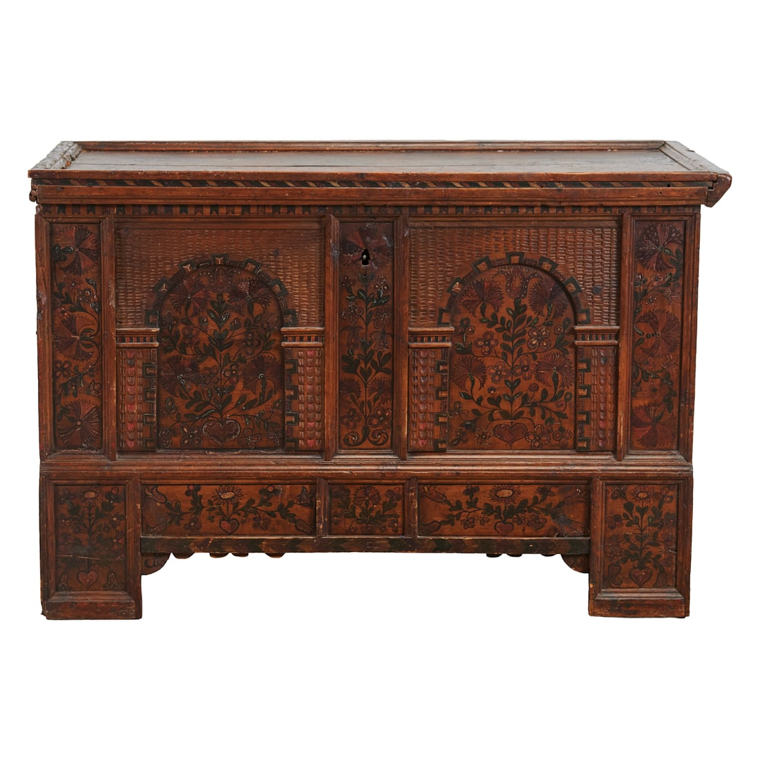 Pennsylvania German Folk Art Painted Chest: Pennsylvania German Folk Art Painted Chest;, top overcast above frame, with shaped, carved panels to front, painted with stylized flowering plants amidst chip carved panels. Possibly made with a