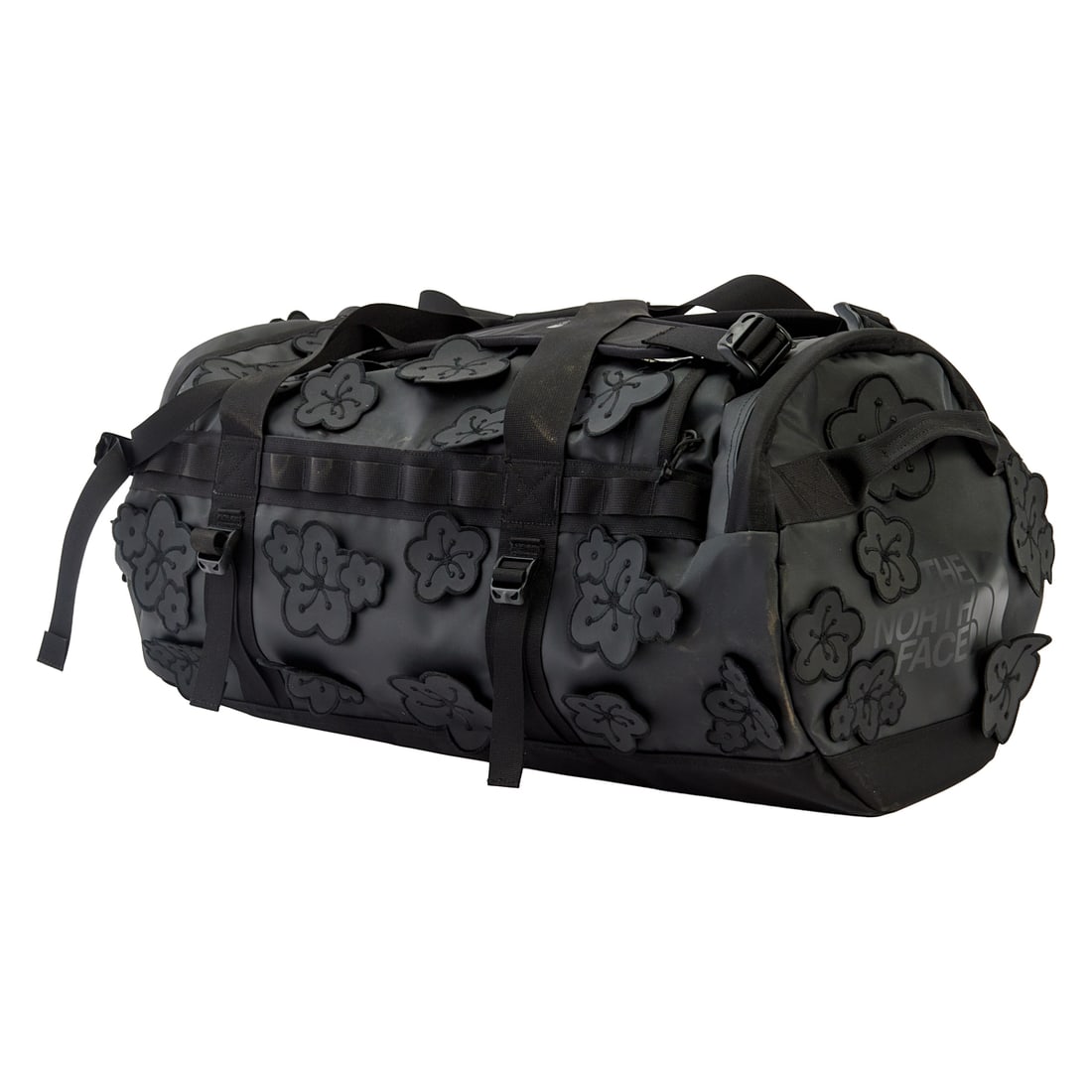 Cecilie Bahnsen X North Face Black Nylon Floral Duffle Bag: Cecilie Bahnsen X North Face Black Nylon Floral Duffle Bag, unused, with original tags to handles. The black cut PVC flowers applied to the black nylon bag top, sides, front and back. Style