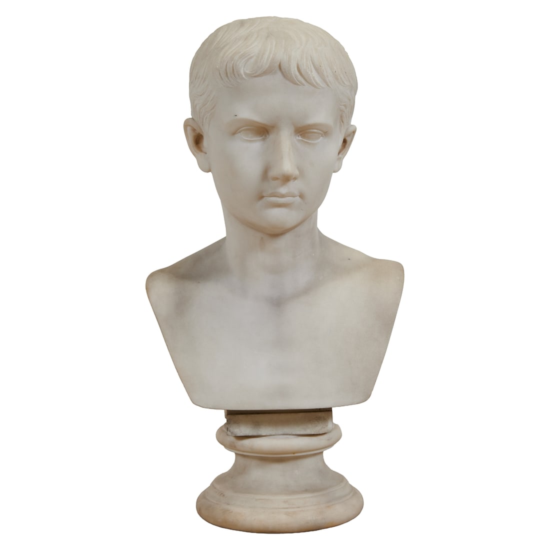 Bust of Augustus Caesar, After the Antique: Bust of Augustus Caesar, After the Antique, the white Carrara bust modeled as the youthful emperor, on a circular socle.;{Approximate dimensions:; 22 3/4" high x 11 1/2" wide x 10 1/2" deep.}.Provenan