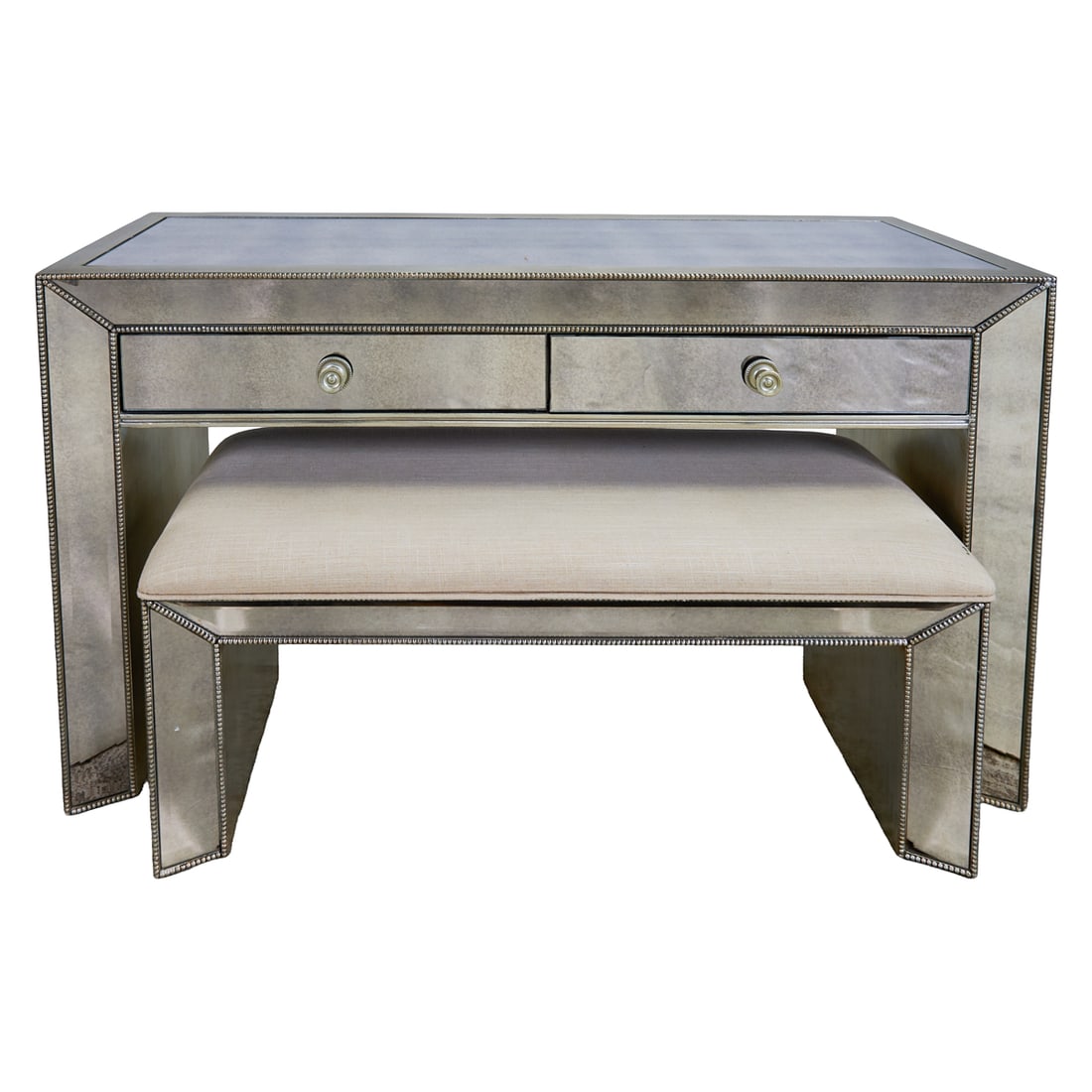 Art Deco Style Mirrored Vanity and Matching Bench: Art Deco Style Mirrored Vanity and Matching Bench, the waterfall top over two shallow drawers, and the fitted settee, of conforming design, inset with mirrored panels throughout.{Approximate