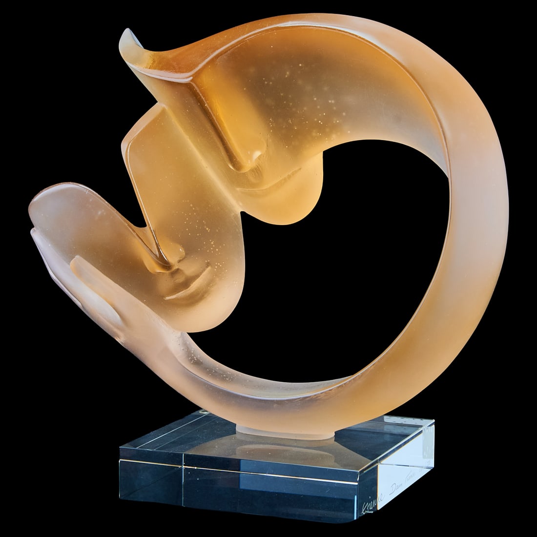 Daum Pate de Verre Crystal Sculpture, La Tendresse: Daum Pate de Verre Crystal Sculpture, La Tendresse by Etienne, the limited edition sculpture of amber ombre to white and clear glass, cast as an abstract circular arm issuing from one face, creating