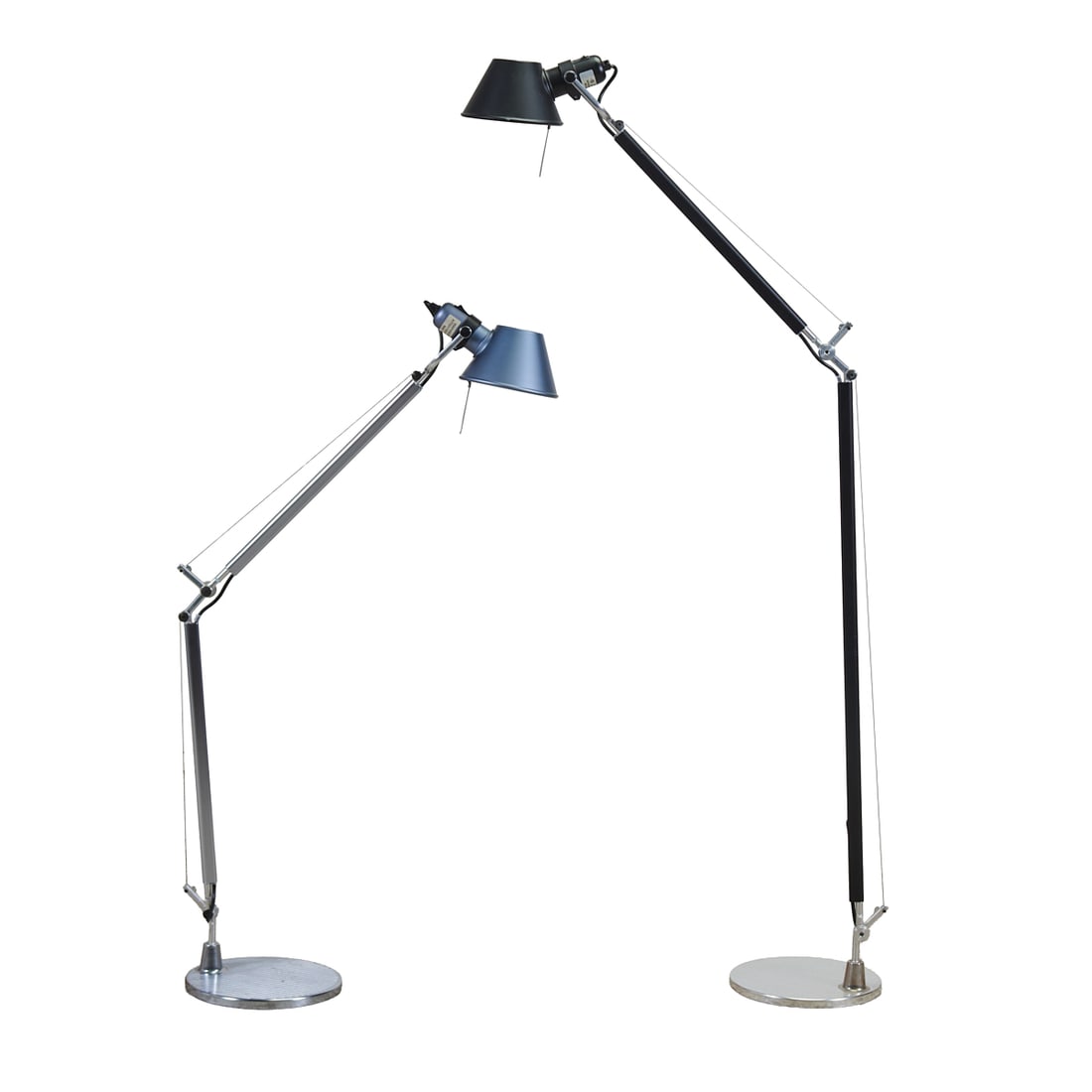 Two Artemide Tolomeo Floor Lamps: Two Artemide Tolomeo Floor Lamps, one chrome and one black, on ribbed round chrome metal weighted bases. The Tolomeo first designed by Michele de Lucchi in 1987.{Approximate dimensions: 63" H. and