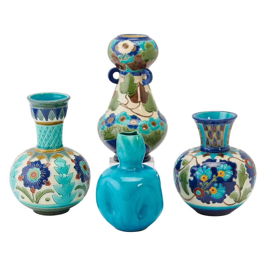 Four Burmantofts Faience Vases: Four Burmantofts Faience Vases, three vases molded in low relief with stylized floral and geometric motifs, and a turquoise ground vase with puckered centers to the four sides of the body, under a