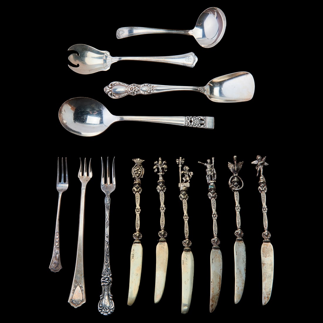 Collection of Sterling and Silverplate Flatware: Collection of Sterling and Silverplate Flatware, comprising 12 Wallace ice cream spoons, give Wallace "Violet" pattern canape forks, six Italian .800 silver canape knives with figural handles; and fiv