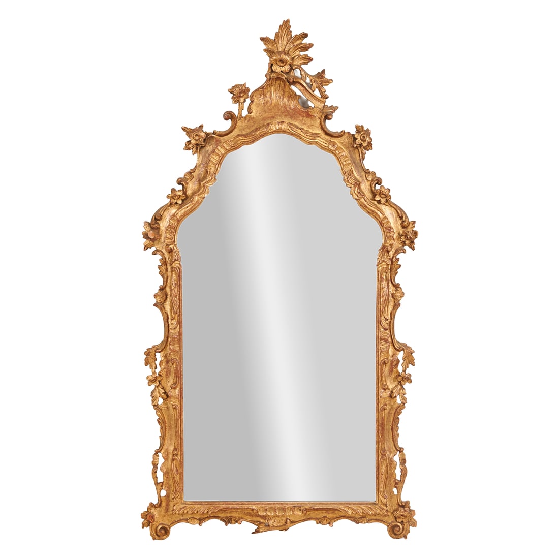 Rococo Style Carved Giltwood Framed Wall Mirror: Rococo Style Carved Giltwood Framed Wall Mirror, the scalloped frame carved with brackets, scrolls, and florettes, under the rayed foliate crest. Circa 1900 with a later plate.{Approximate dimensions:
