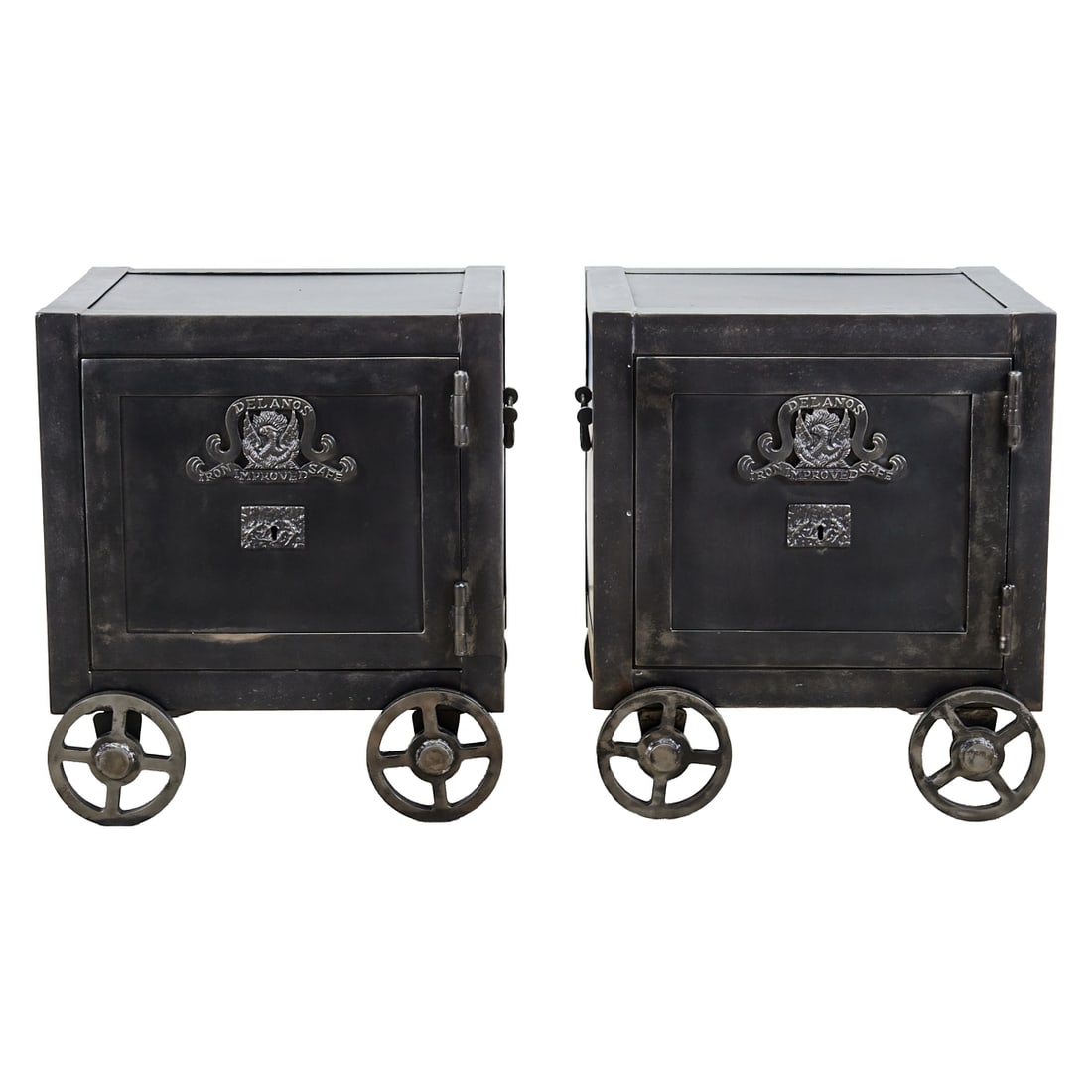 Pair of Safe Style Metal Clad Nightstands on Wheels: Pair of Safe Style Metal Clad Nightstands on Wheels, the fronts decorated with "DELANO IRON IMPROVED SAFE," surrounding phoenix amidst flames, in low relief, in white metal; above the lock