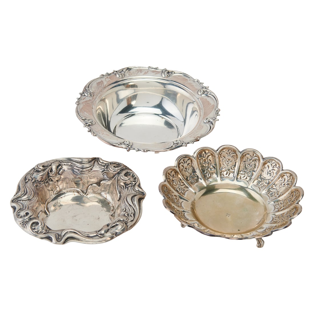 Three Sterling Silver Bowls and Candy Dishes: Three Sterling Silver Bowls and Candy Dishes, comprising a Wallace Sterling Co. bowl, the rim chased and repousse with irises among swirling Art Nouveau stems and leaves, pattern 908; an