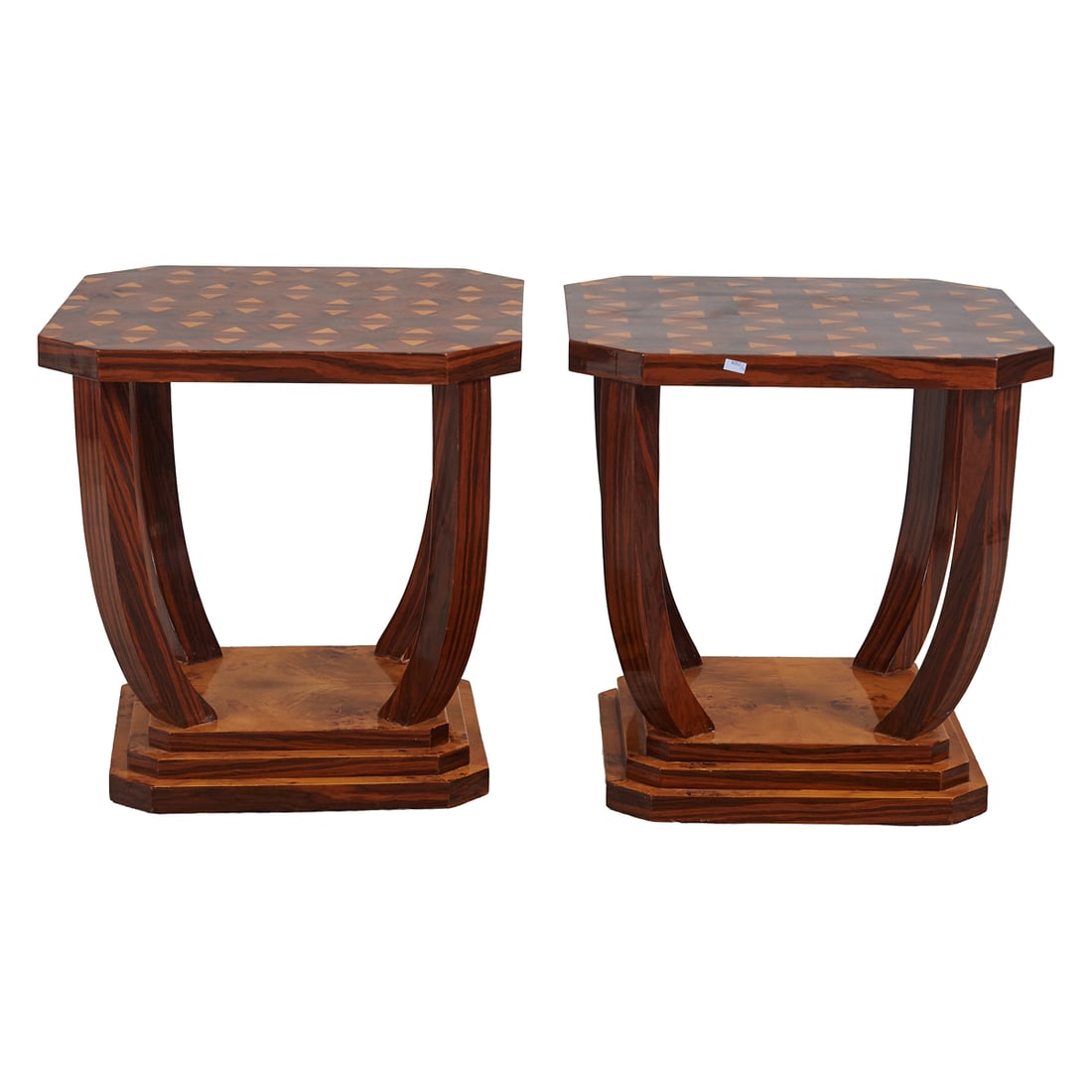 Pair of Art Deco Style Inlaid Octagonal Tables: Pair of Art Deco Style Inlaid Octagonal Tables, the tops with dramatic geometric designs in contrasting woods, with canted corners, over quadripodal legs, conjoined by the stepped bases of conforming 