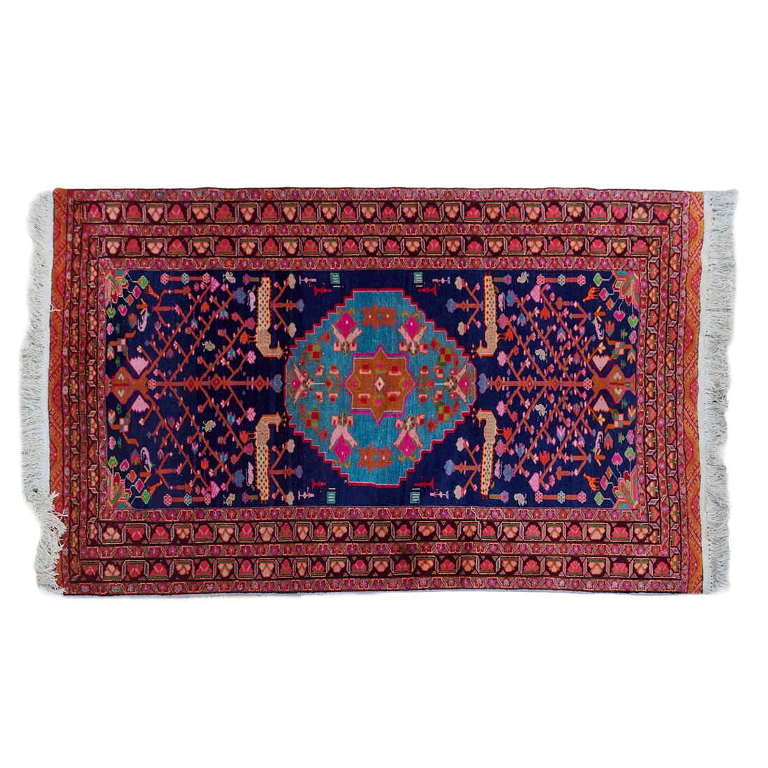 Persian Serapi Wool and Cotton Pictorial Rug: Persian Serapi Wool and Cotton Pictorial Rug, dark blue field, surrounding a;medium blue central medallion,;each end woven with many colors with a stylized tree with blooms and fruit, and;peafowl, enc